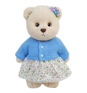 Teddy bear in blue clothing