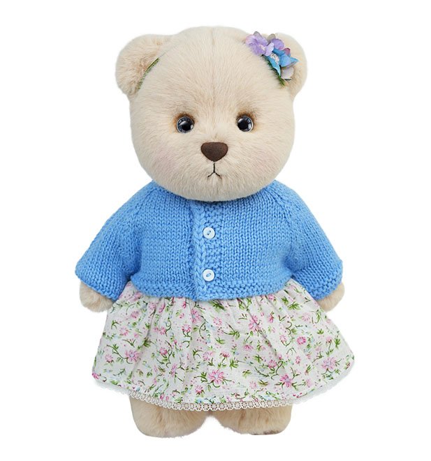 Teddy bear in blue clothing